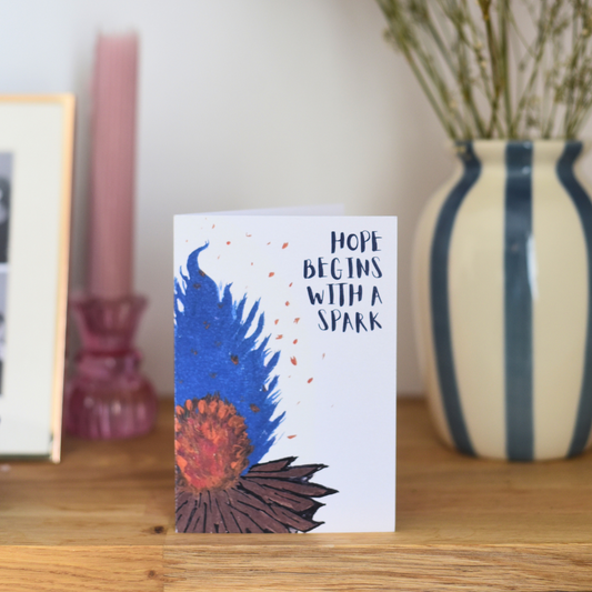 'Hope begins with a spark' Greeting card